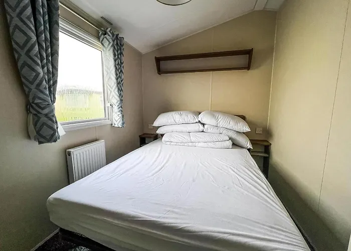Lovely Caravan With Decking On California Cliffs Holiday Park Ref 50045C