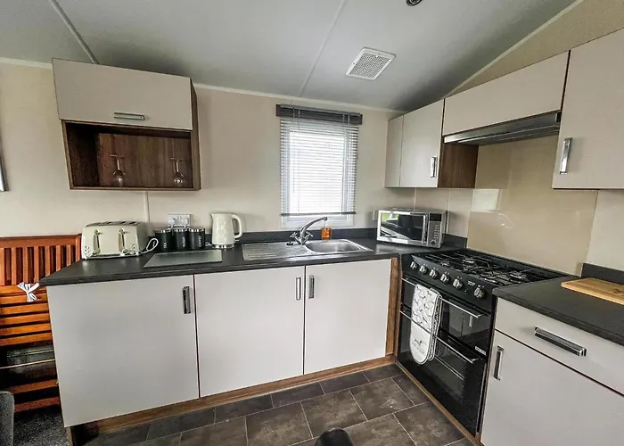 Lovely Caravan With Decking On California Cliffs Holiday Park Ref 50045C